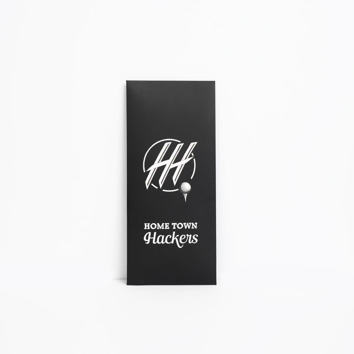 Black packaging box for premium golf glove for lefties with Home Town Hackers logo